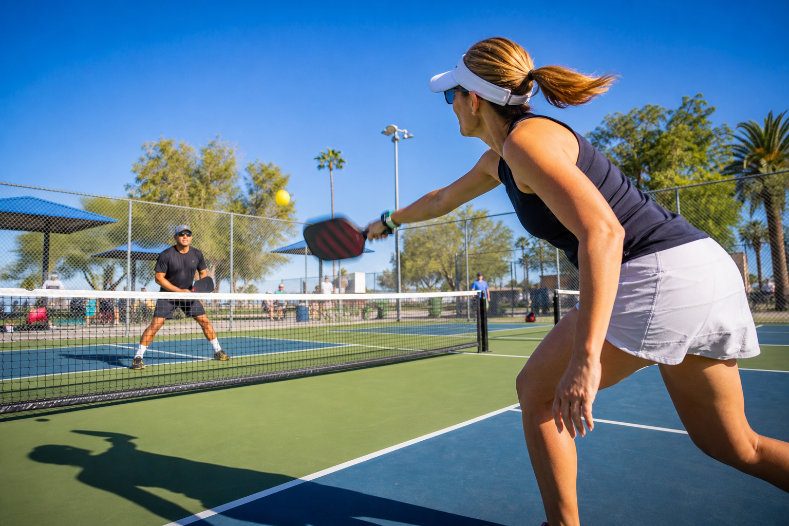 Players competing on an outdoor pickleball court